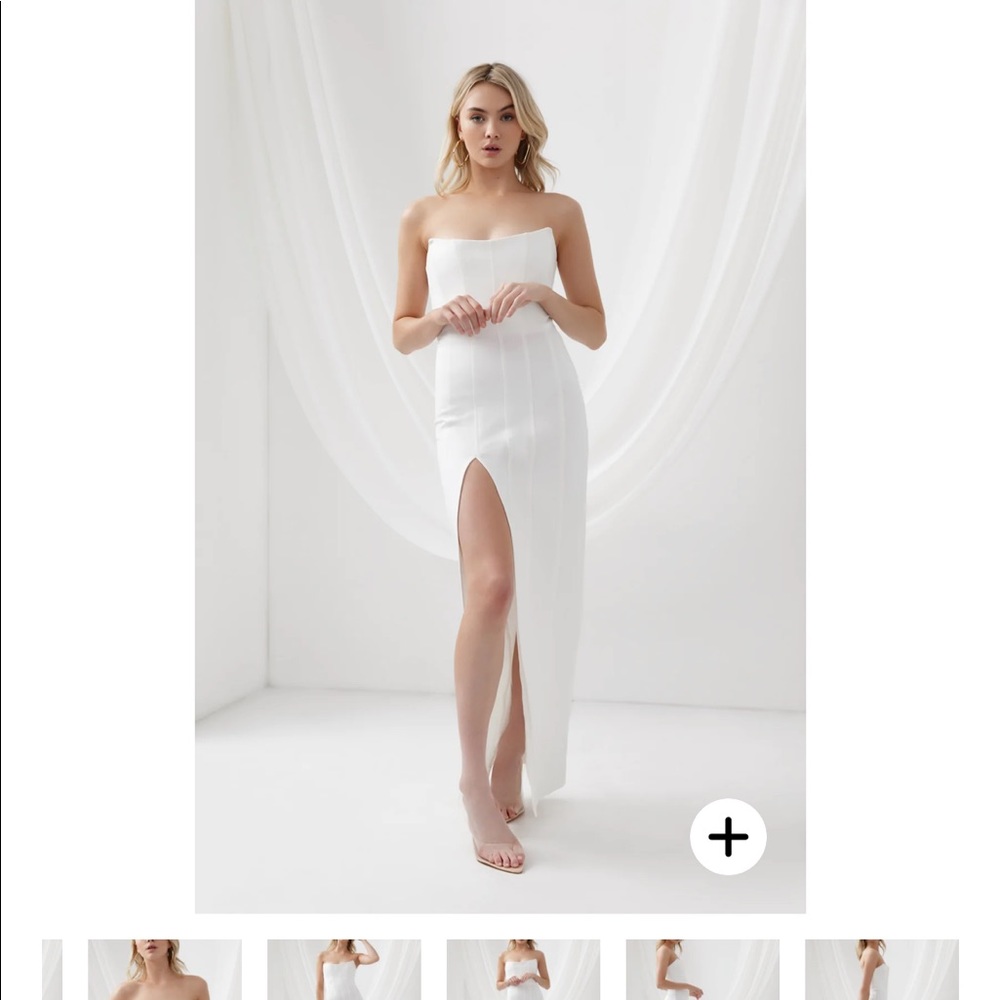 New- AU 08/ US 04 sized white dress. Great body hugging material